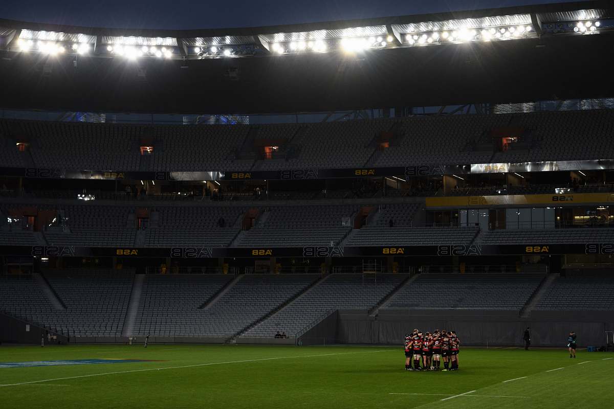 eden park group of football players on green grass field new zealand